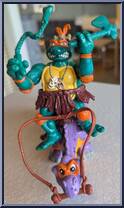 Cave Turtle Mike (with Silly Stegosaurus) from Teenage Mutant Ninja Turtles - Cave Turtles manufactured by Playmates [Loose]